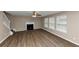 Spacious living room featuring a fireplace and hardwood floors at 2114 Black Oak Ln, Ellenwood, GA 30294