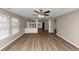 Open living room with hardwood floors and kitchen view at 2114 Black Oak Ln, Ellenwood, GA 30294