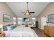 Main bedroom with vaulted ceiling, ceiling fan, and lots of natural light at 2114 Black Oak Ln, Ellenwood, GA 30294