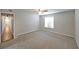 Well-lit bedroom with neutral walls and carpeted flooring at 1707 Brighton Pt, Sandy Springs, GA 30328