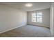 Well-lit bedroom with a large window and carpet flooring at 3065 Vineyard Se Way, Smyrna, GA 30082