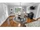 Elegant dining room with hardwood floors and a round glass-top table at 2100 Davis Academy Rd, Rutledge, GA 30663