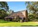 Brick house with a large deck and backyard at 2100 Davis Academy Rd, Rutledge, GA 30663
