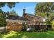 Brick house with deck and landscaped yard at 2100 Davis Academy Rd, Rutledge, GA 30663