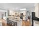 Modern kitchen with granite countertops and an island with seating at 2100 Davis Academy Rd, Rutledge, GA 30663