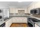 Kitchen with granite countertops and stainless steel appliances at 2100 Davis Academy Rd, Rutledge, GA 30663