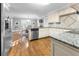 Spacious kitchen featuring granite countertops and stainless steel appliances at 2100 Davis Academy Rd, Rutledge, GA 30663