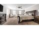 Spacious main bedroom with a large bed and sitting area at 2100 Davis Academy Rd, Rutledge, GA 30663