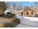 Updated house exterior boasts a modern white facade and stone accents at 1825 Niskey Lake Rd, Atlanta, GA 30331