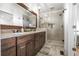 Double vanity bathroom with a walk-in shower and granite countertop at 2332 Ewing Ne Dr, Atlanta, GA 30319