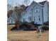 Two-story house with blue siding, landscaping, and a staircase at 5711 Brynwood Nw Cir, Acworth, GA 30101