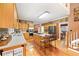 Spacious kitchen with a center island, oak cabinetry, and an open view to the dining area at 5711 Brynwood Nw Cir, Acworth, GA 30101