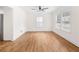 Spacious living room with hardwood floors and large windows at 1576 Mims Sw St, Atlanta, GA 30314