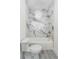 Clean bathroom with a marble shower and a toilet at 2312 Herring Sw Rd, Atlanta, GA 30311