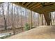 Covered patio with ceiling fan and view of the backyard at 2341 Standing Peachtree Nw Ct, Kennesaw, GA 30152