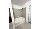 Clean bathroom with tiled floors and bathtub at 250 Pharr Ne Rd # 507, Atlanta, GA 30305