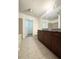 Modern bathroom with granite countertop and tiled floors at 250 Pharr Ne Rd # 507, Atlanta, GA 30305