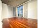 Large bedroom with hardwood floors and large windows at 250 Pharr Ne Rd # 507, Atlanta, GA 30305