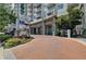 Modern building exterior with landscaped entryway and signage at 250 Pharr Ne Rd # 507, Atlanta, GA 30305