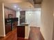 Modern kitchen with island, granite countertops, and hardwood floors at 250 Pharr Ne Rd # 507, Atlanta, GA 30305