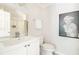 Clean bathroom with a vanity, toilet, and shower/tub combo at 1801 Cumberland Valley Pl, Atlanta, GA 30080