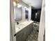 Shared bathroom with double vanity and patterned floor at 2501 Bradford Sq, Atlanta, GA 30345