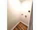 Simple laundry area with wood flooring at 2501 Bradford Sq, Atlanta, GA 30345