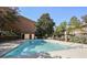 Community swimming pool with brick building in background at 2501 Bradford Sq, Atlanta, GA 30345