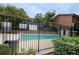 Community swimming pool with a black metal fence at 2501 Bradford Sq, Atlanta, GA 30345