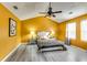 Spacious bedroom with wood-look floors and ceiling fan at 3447 Portsmouth Cir, Stonecrest, GA 30038