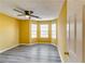 Bright bedroom with wood-look floors and bay window at 3447 Portsmouth Cir, Stonecrest, GA 30038