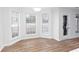 Breakfast nook boasting a bay window and wood-look vinyl flooring at 4100 Chanticleer Nw Dr, Kennesaw, GA 30152