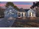 Charming single-story home with white siding, attached garage, and well-manicured lawn at 4100 Chanticleer Nw Dr, Kennesaw, GA 30152