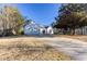 Two-car garage and front yard with long driveway at 4100 Chanticleer Nw Dr, Kennesaw, GA 30152