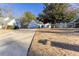 Two-car garage and front yard with long driveway at 4100 Chanticleer Nw Dr, Kennesaw, GA 30152