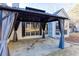 Covered patio with gazebo and gray curtains at 4100 Chanticleer Nw Dr, Kennesaw, GA 30152