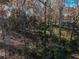 Property line of wooded lot, showing a partially visible house at 5375 Northland Ne Dr, Sandy Springs, GA 30342