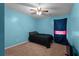 Small bedroom with light blue walls and a full-size bed at 1105 Huntcrest Rdg, Mcdonough, GA 30252