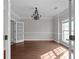 Spacious dining room with hardwood floors and chandelier at 1105 Huntcrest Rdg, Mcdonough, GA 30252