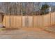 Wooden privacy fence with double gate at 1105 Huntcrest Rdg, Mcdonough, GA 30252