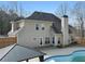 Rear view of house showing a two-story home with pool at 1105 Huntcrest Rdg, Mcdonough, GA 30252