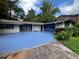 Ranch style home with blue driveway and landscaping at 2323 Valleyside Dr, Decatur, GA 30032