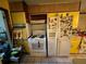 White appliances and yellow cabinets in this retro kitchen at 2323 Valleyside Dr, Decatur, GA 30032