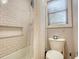 Clean bathroom with subway tile shower/tub combo at 134 N Johnson N St, Newborn, GA 30056