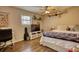 Bedroom with hardwood floors, a bed, and a workspace at 134 N Johnson N St, Newborn, GA 30056