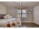 Bright bedroom featuring a comfortable bed and large window at 134 N Johnson N St, Newborn, GA 30056