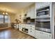 Kitchen with white cabinets and stainless steel appliances at 134 N Johnson N St, Newborn, GA 30056