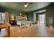 Spacious main bedroom with dark green walls, a wooden headboard, and hardwood floors at 134 N Johnson N St, Newborn, GA 30056