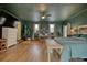 Spacious main bedroom with dark green walls, a wooden headboard, and hardwood floors at 134 N Johnson N St, Newborn, GA 30056