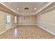 Spacious finished basement with hardwood floors and recessed lighting at 1924 Wilkenson Xing, Marietta, GA 30066